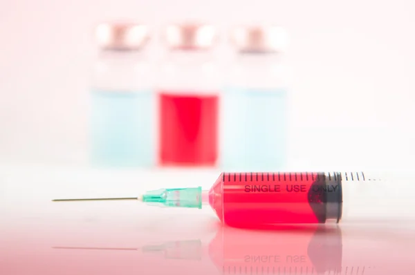 Disposable syringe and injection vial background