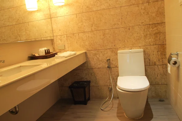 Closed up bathroom in yellow light — Stock Photo, Image