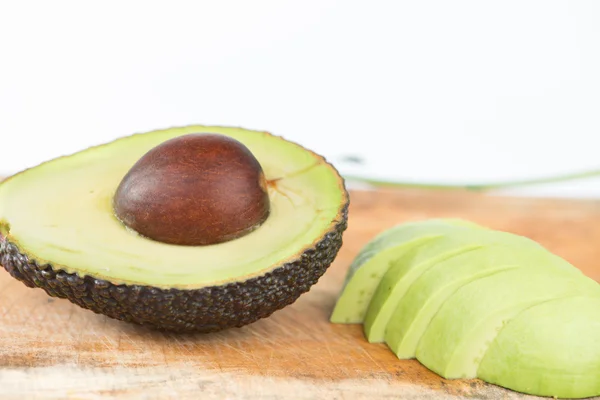 Frutta di avocado su legno — Foto Stock