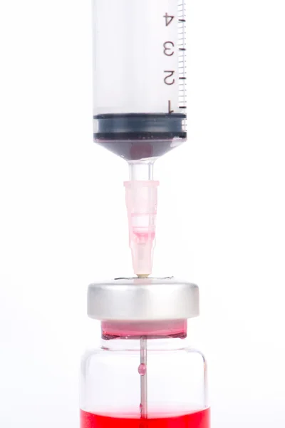 Injection syringe on vial show medicine and healthcare backgroun — Stock Photo, Image