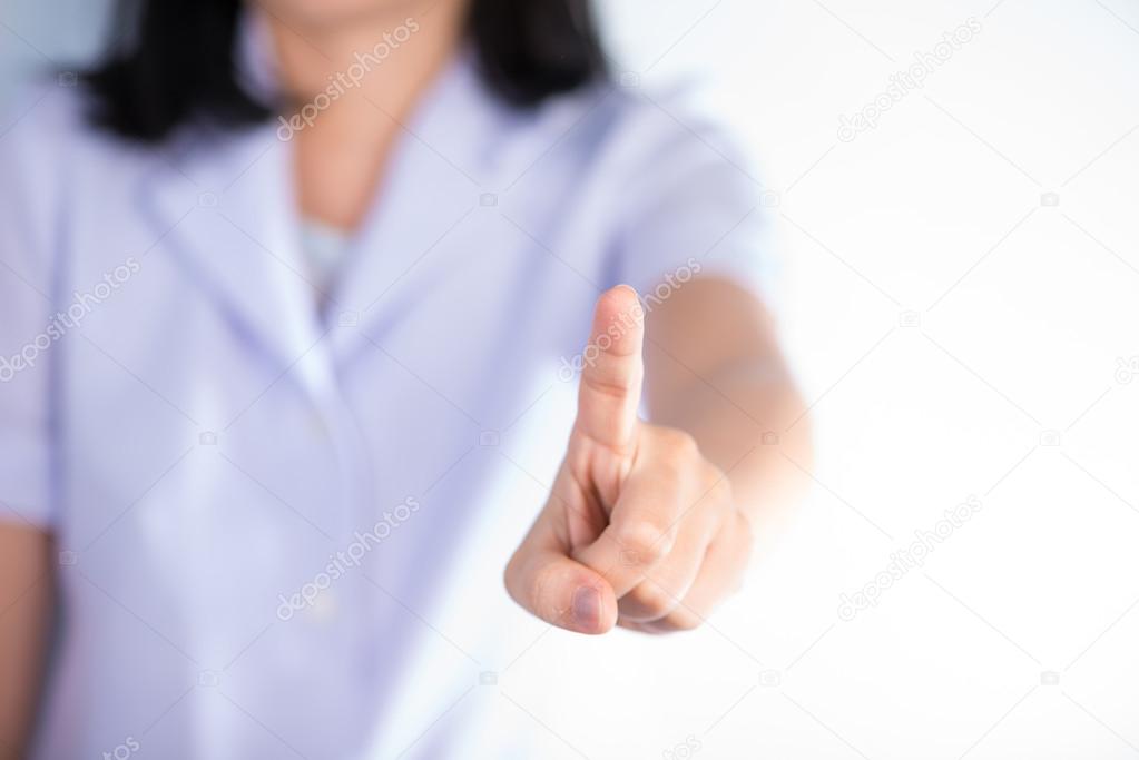 Nurse pressing type with finger of hand show business and health