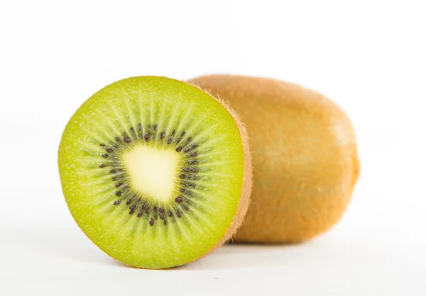 Sliced and cut kiwi fruit on white — Stock Photo, Image