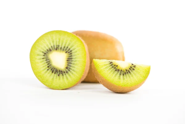 Sliced and cut kiwi fruit on white — Stock Photo, Image
