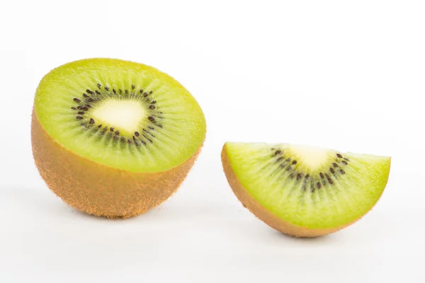 Sliced and cut kiwi fruit on white — Stock Photo, Image