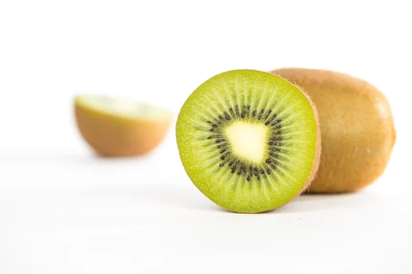 Sliced and cut kiwi fruit on white — Stock Photo, Image