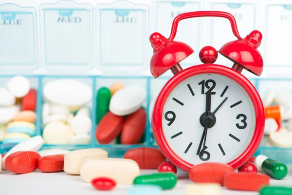 Closed Up alarm clock and medicine background — Stock Photo, Image