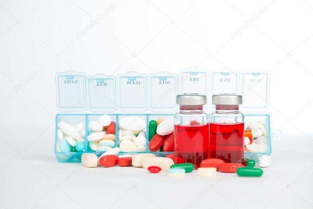 Injection vials and medicine in weekly pill box