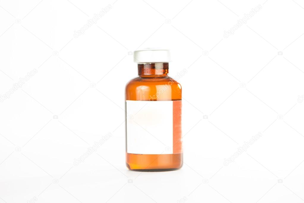 Brown medicine ampule on white