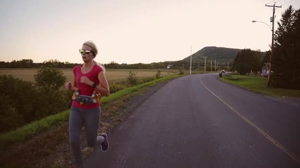 Slow Motion of Woman Running Alone on the side of the Street — Videoclip de stoc