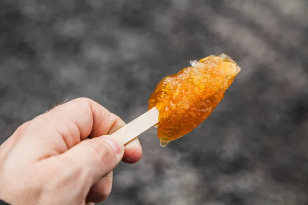 Maple Taffy on a wood stick — Stock Photo, Image