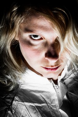 Scary Blonde Woman Looking at the Camera clipart