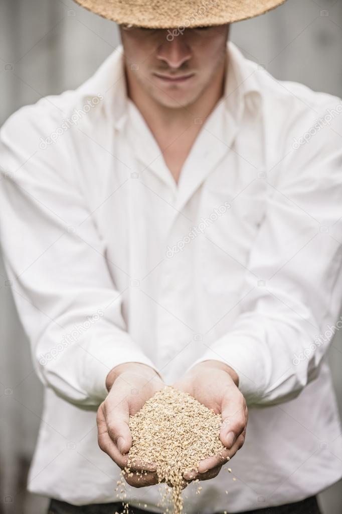 Farmer Showing Animal Dry Food