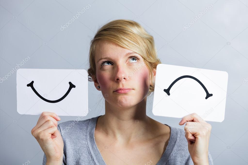 Portrait of a Person Holding Happy and Unhappy Mood Board
