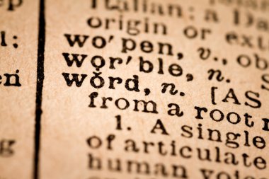 Close-up of an Opened Dictionary showing the Word WORD clipart