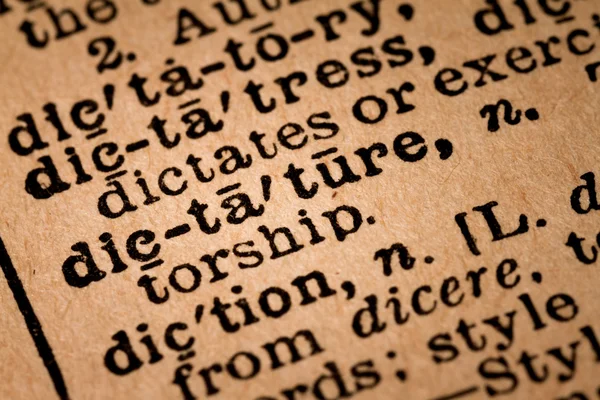 Close-up of an Opened Dictionary showing the Word DICTATURE — Stock Photo, Image