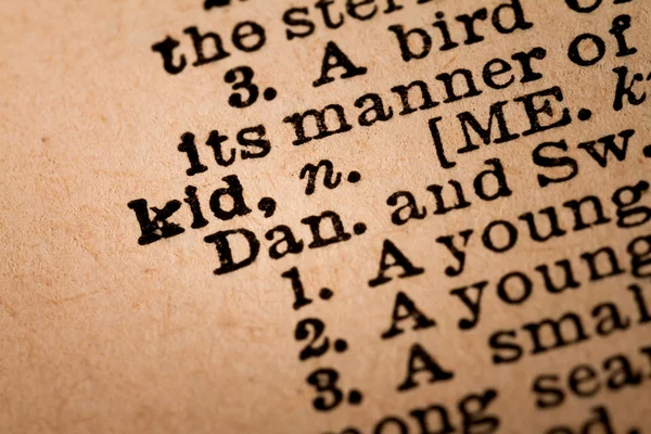Close-up of an Opened Dictionary showing the Word KID — Stock Photo, Image