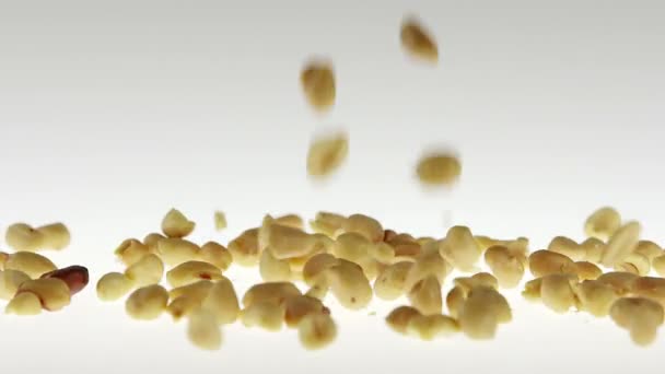 180fps Super Slow Motion Peanuts Falling on White Surface — Stock Video