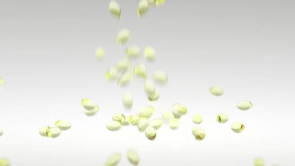 180fps super pomalý pohyb vitamín D padající přes bílé pozadí — Stock video