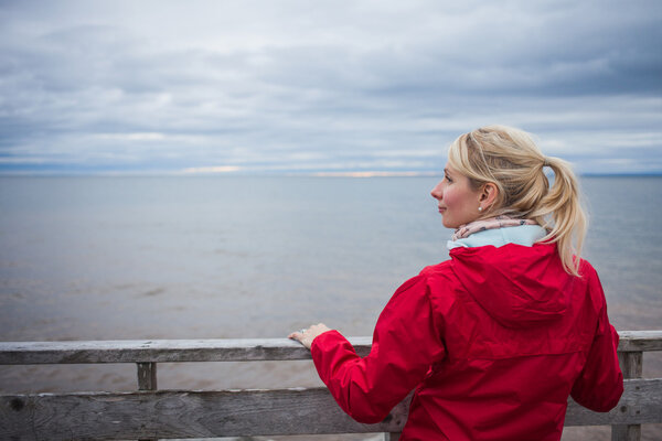 Woman Looking a the View of the Ocean