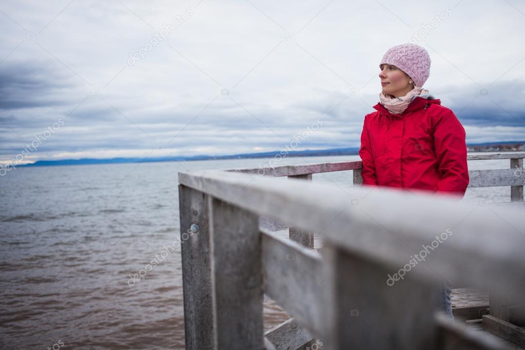Woman Looking a the View of the Ocean