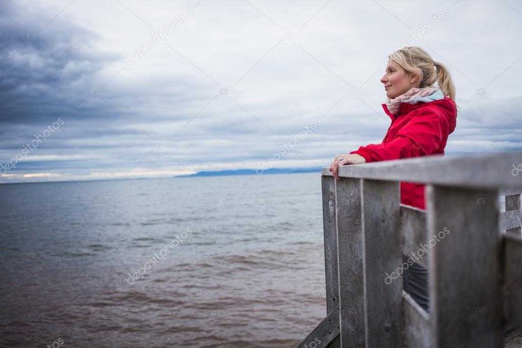 Woman Looking a the View of the Ocean