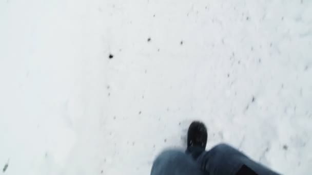 Man Walking over path in the Snow — Stock Video