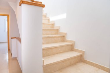 Staircase in a private house leading upstairs clipart