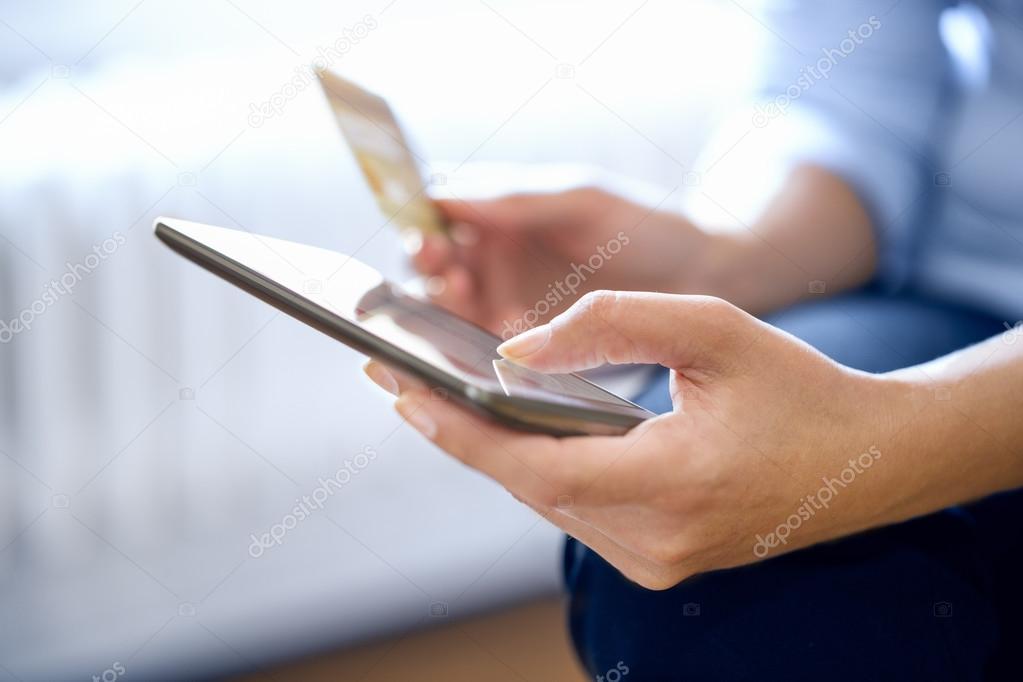 Woman shopping online in mobile phone