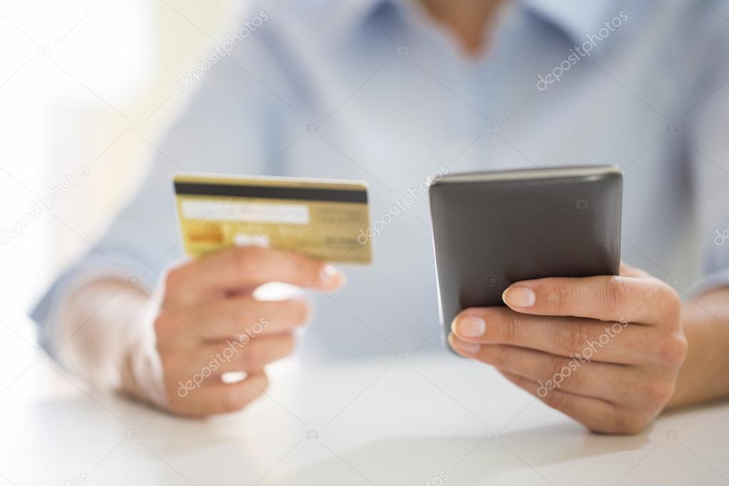 Woman shopping online in mobile phone