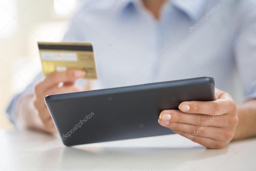 Woman shopping online with digital tablet