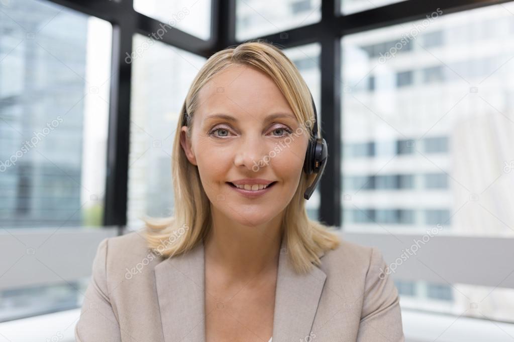 businesswoman with headset on video conference