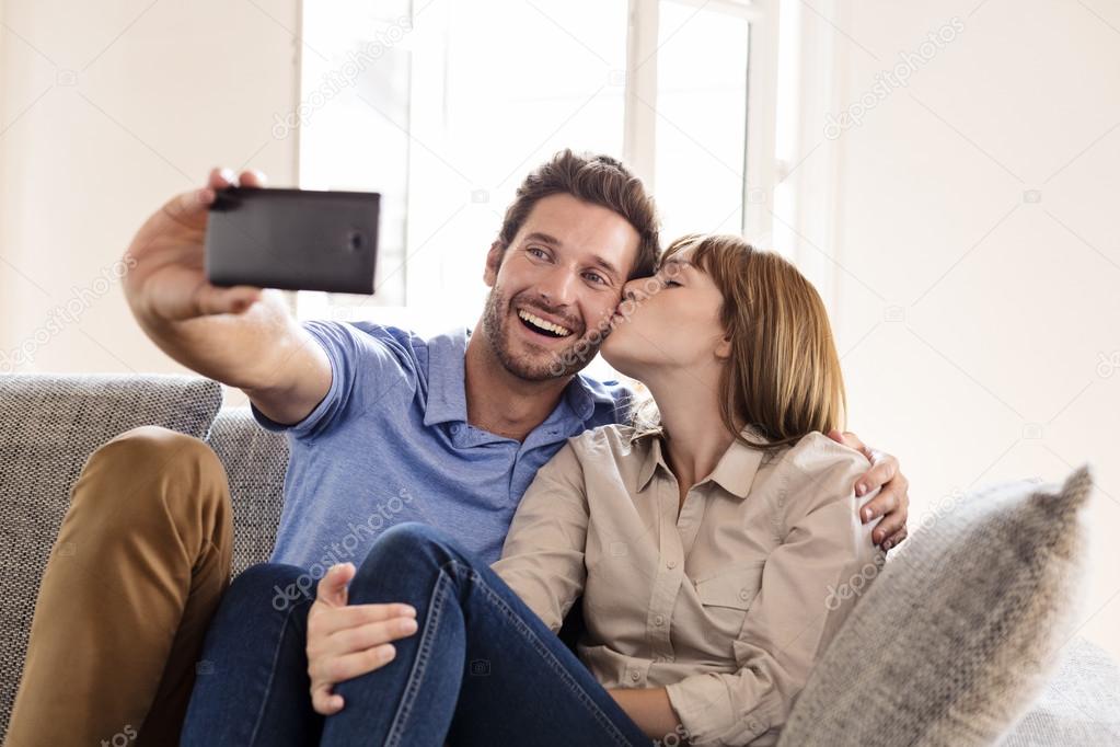 Couple in love taking a selfie with a mobile phone