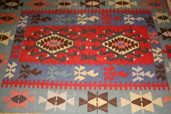Um padrão de tapete turco como pano de fundo — Fotografia de Stock