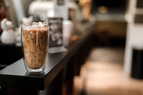 stock image Close-up glass of iced coffee with milk on the table