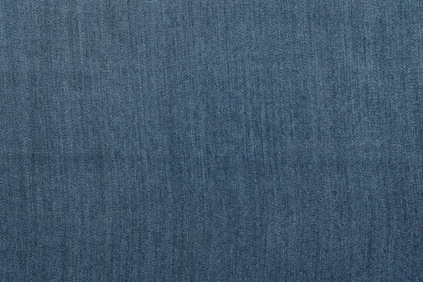 Texture rugueuse tissu denim fond monochrome de couleur bleu foncé — Photo