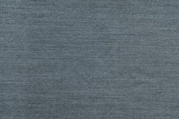 Szorstki tekstura denim tkaniny monochromatyczne tła blady kolor srebrzysty — Zdjęcie stockowe