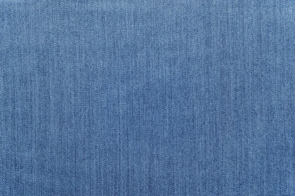 Hrubé textury džínové látka jednobarevné pozadí bledě modré barvy — Stock fotografie