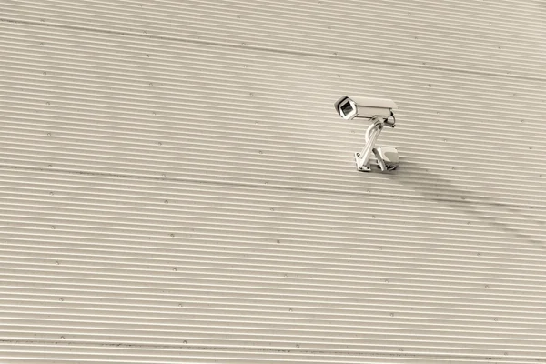 chamber for video surveillance on a wall from corrugated iron