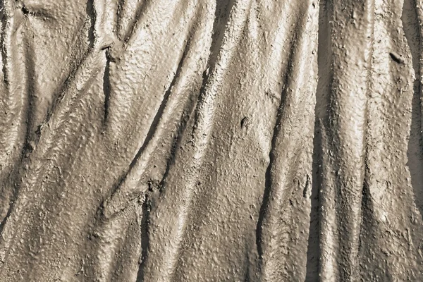 Abstrakt ojämn texturerat bakgrund av beige färg — Stockfoto