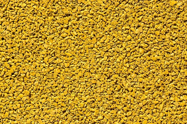 The granulated background of yellow color — Stock Photo, Image