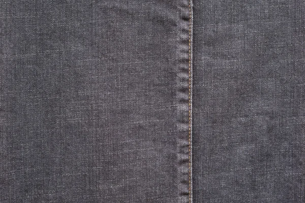 Textuur denim met de gestikte naad van donkere kleur — Stockfoto