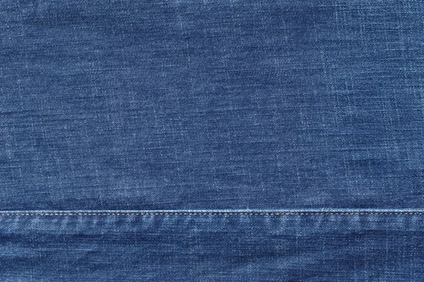 Textura de mezclilla con la costura cosida de color azul — Foto de Stock