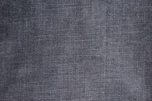 Текстурированный фон из джинсы темного цвета — стоковое фото