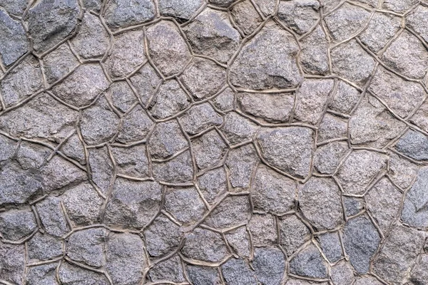 Raue Steinstruktur von grauer Farbe — Stockfoto