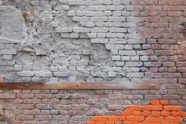 Damaged texture of a brick wall — Stock Photo, Image