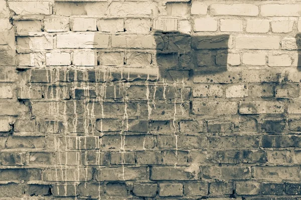 Superficie di un muro di mattoni con macchie di colore seppia sporco — Foto Stock