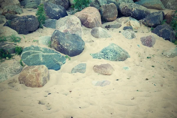 Steine auf Sand auf dem Foto im Retro-Stil — Stockfoto