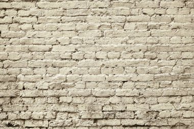 Eski tuğla duvarın katı parçası soluk renkli klasik desenli arka plan için