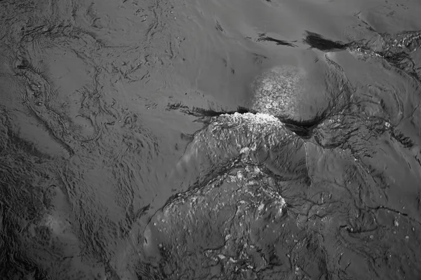 surface of stormy water with swirl around the stone for an abstract black background