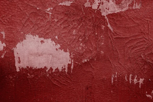 Vieux cuir de tissu de couleur rouge avec des attritions — Photo